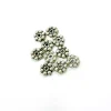 Outlet Set de 10 cuentas de flores plata Bisutería